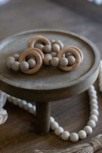 Teething ring in wood and taupe silicone