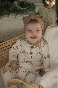 Pink beige evolving onesie with winter cabin pattern (imperfect)