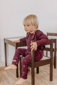 Evolutionary aubergine overalls with owl pattern