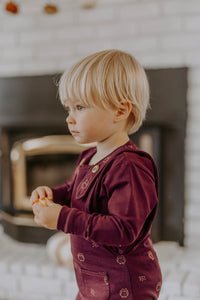 Evolutionary aubergine overalls with owl pattern